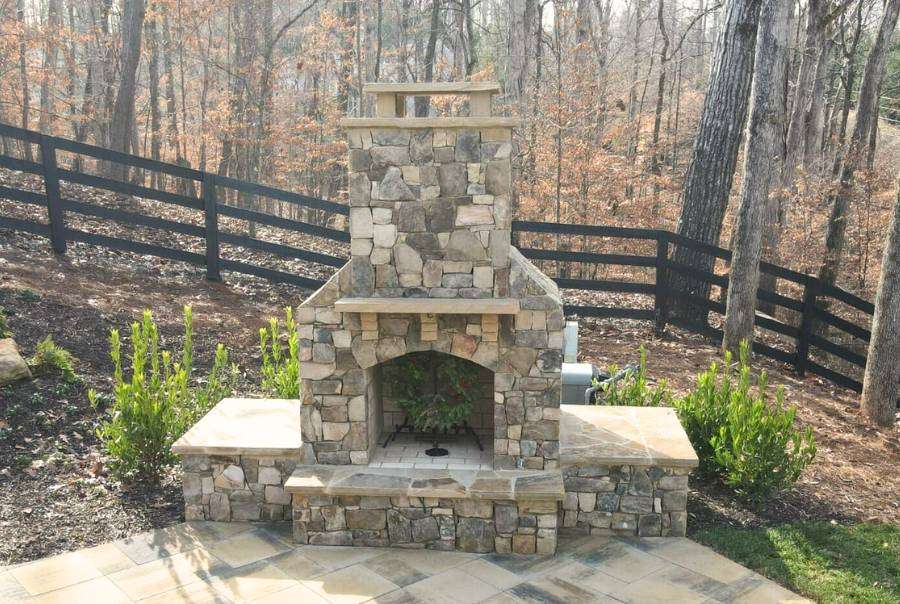 Outdoor Stone Fireplace A Wooden Fence
