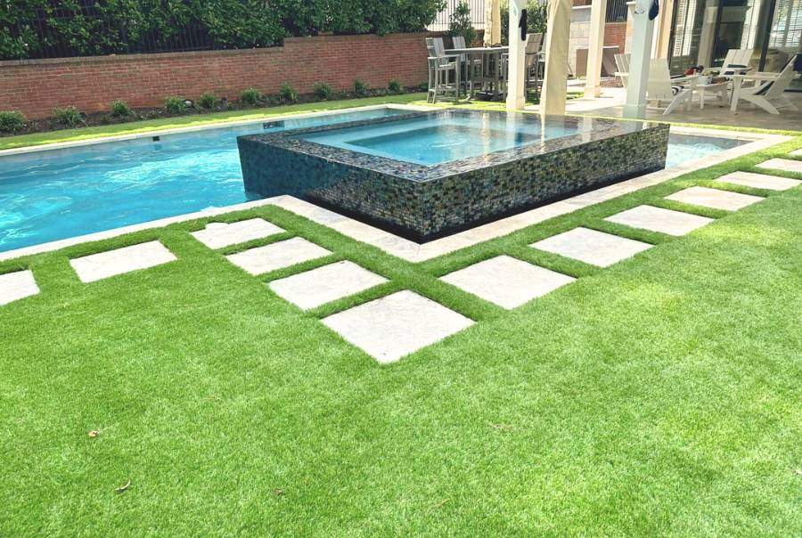 Modern Pool With Raised Spa And Green Lawn