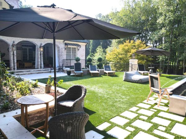 Patio With Furniture, Sun Loungers And Umbrella