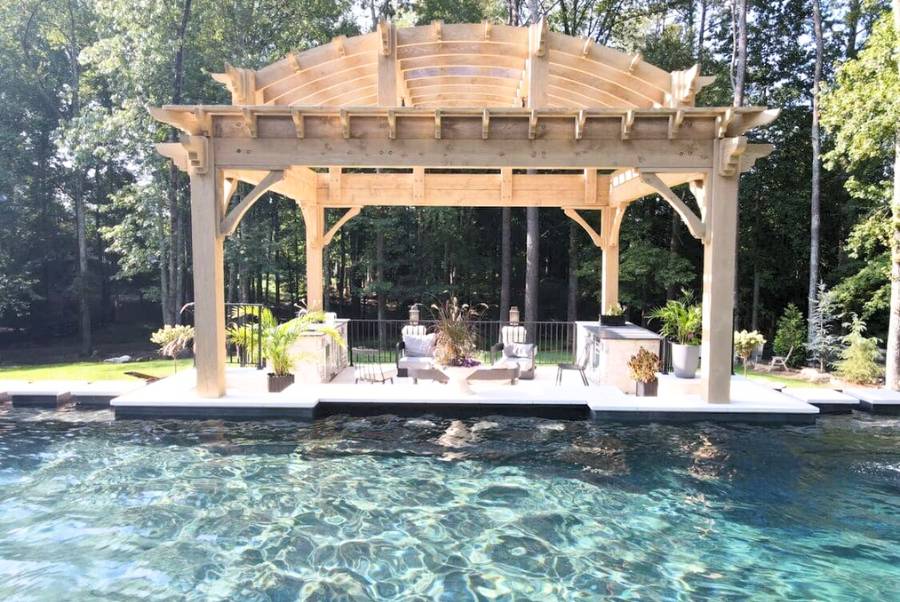 Pool Area With Wooden Pergola And Lounge Chairs