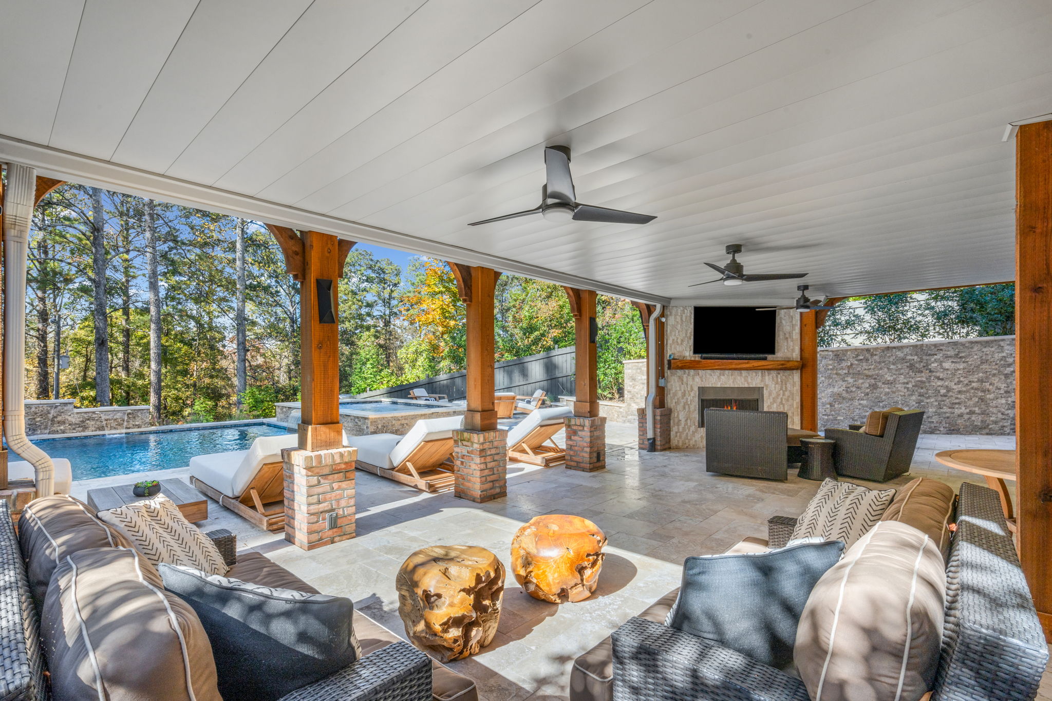 Elegant modern swimming pool with raised spa, clean architectural lines, and beautifully designed landscape.